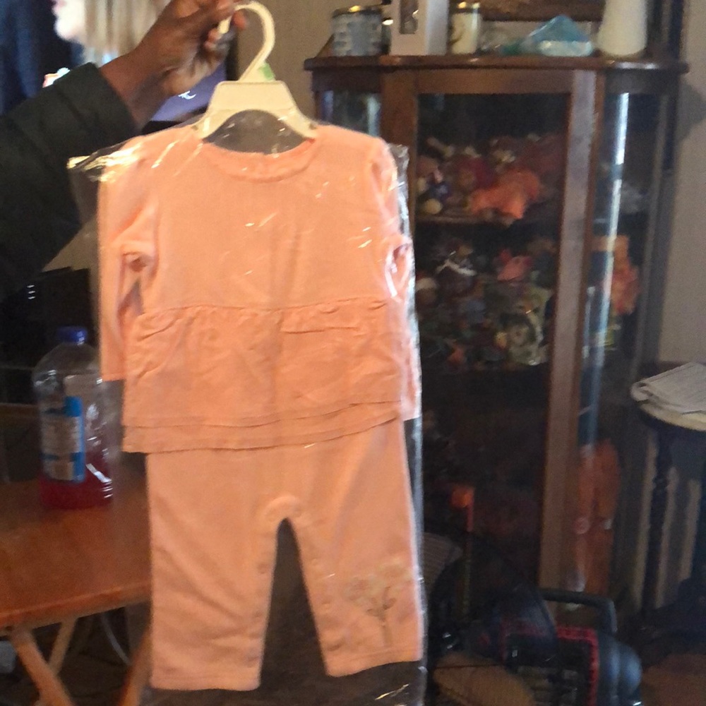 Child jumper pink in color white flower on leg